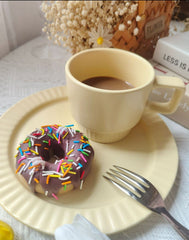 Vela decorativa de donas con chispas de arcoíris