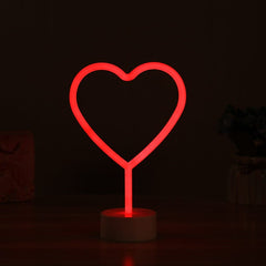 Letrero luminoso de neón de corazón rojo