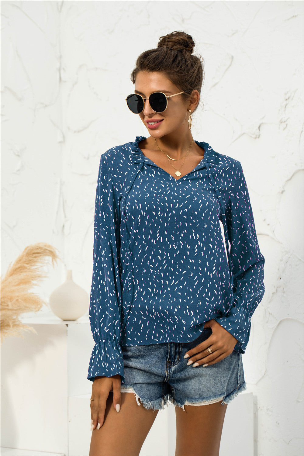 Blusa con mangas abullonadas y estampado suave