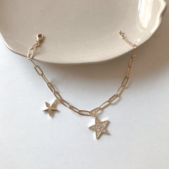 Pulsera colgante de estrella dorada