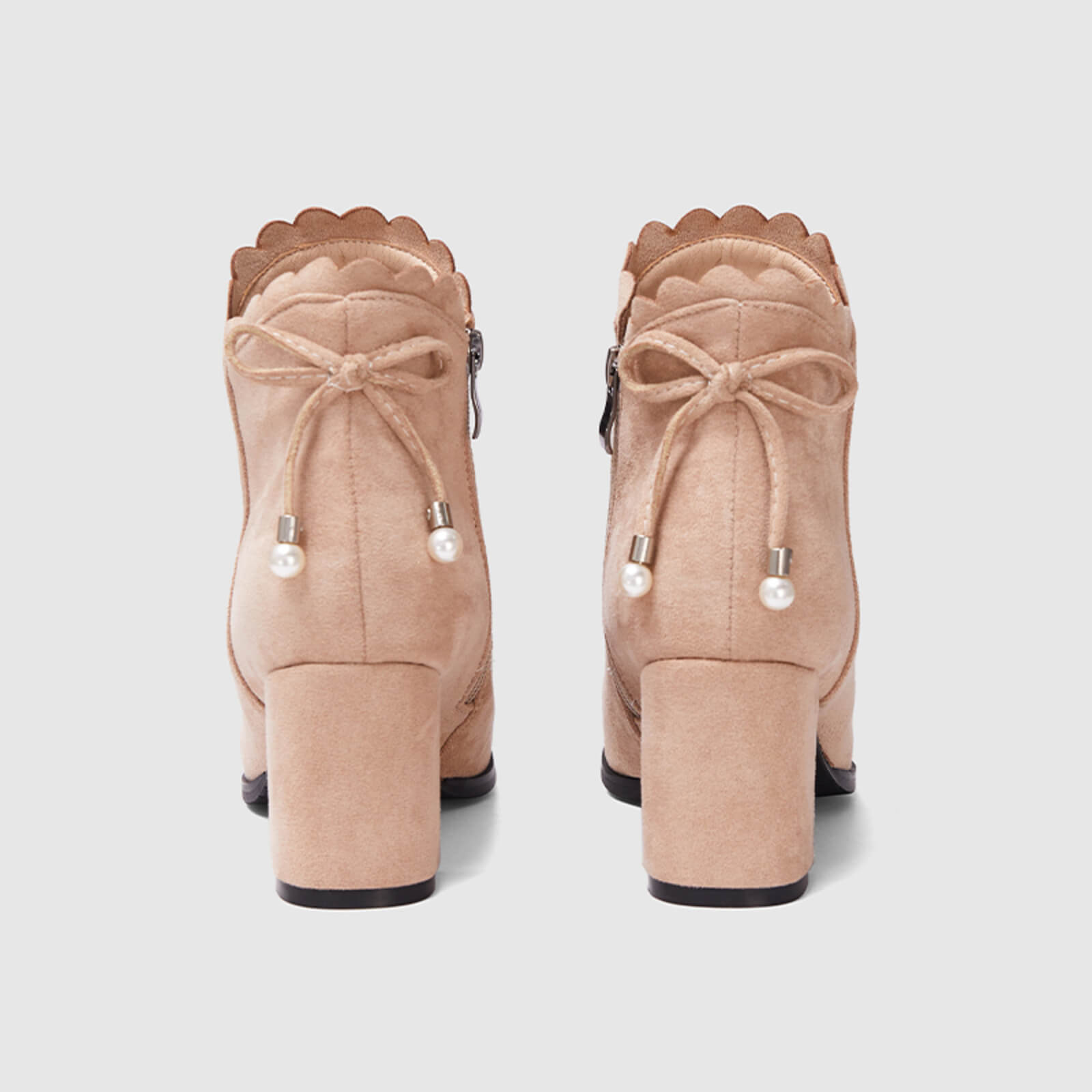 Botines con lazo festoneado y cremallera lateral 