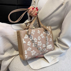 Bolso tote con estampado floral y cadenas de flores