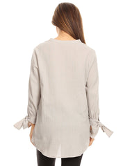 Blusa plisada con mangas abiertas