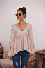 Blusa con dobladillo plisado y mangas abullonadas