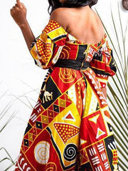 Vestido con abertura alta, espalda descubierta y estampado multicolor